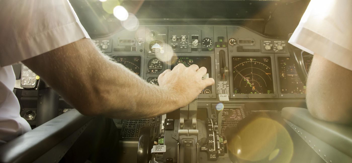 Image: Pilots before takeoff at sunset. (photo via MatusDuda / iStock / Getty Images Plus)