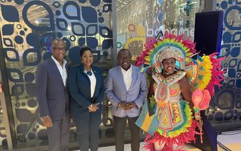 Bahamas Tourism leaders with DPM Chester Cooper and Junkanoo dancer