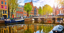 Historic buildings and canal in Amsterdam's historic center.