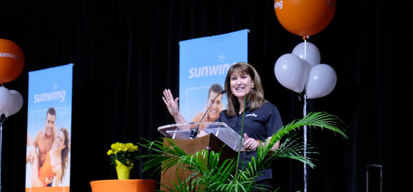 Image: Deana Murphy talks with travel agents at Sunwing's Vacation Better event in Toronto on May 1, 2019. (Photo Credit: Jim Byers/TravelPulse Canada)