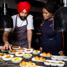 Crown Shy's Executive Chef Jassimran Singh with JetBlue crewmember
