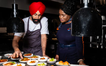 Crown Shy's Executive Chef Jassimran Singh with JetBlue crewmember