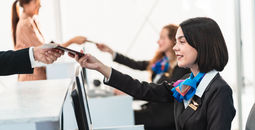 Traveler getting airline tickets.