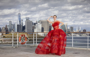 Coco Rocha wears a signature Christian Siriano design aboard Cunard's Queen Mary 2