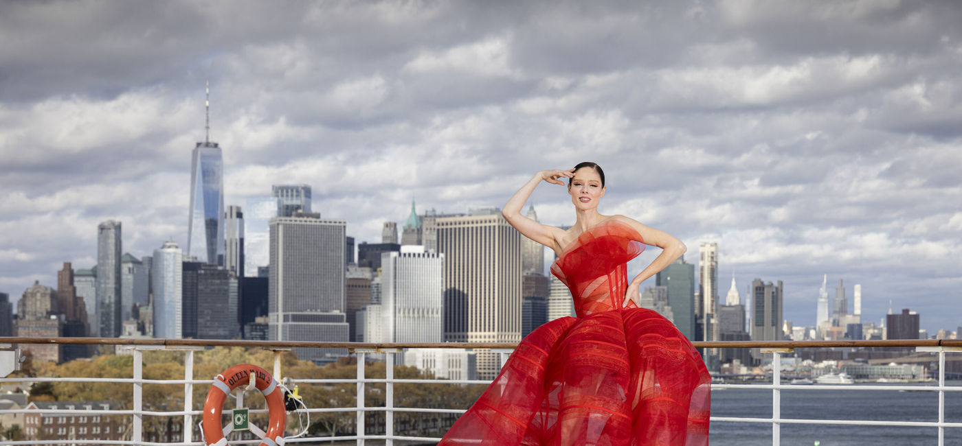 Image: Coco Rocha wears a signature Christian Siriano design aboard Cunard's Queen Mary 2 (Photo Credit: Chris Ison)