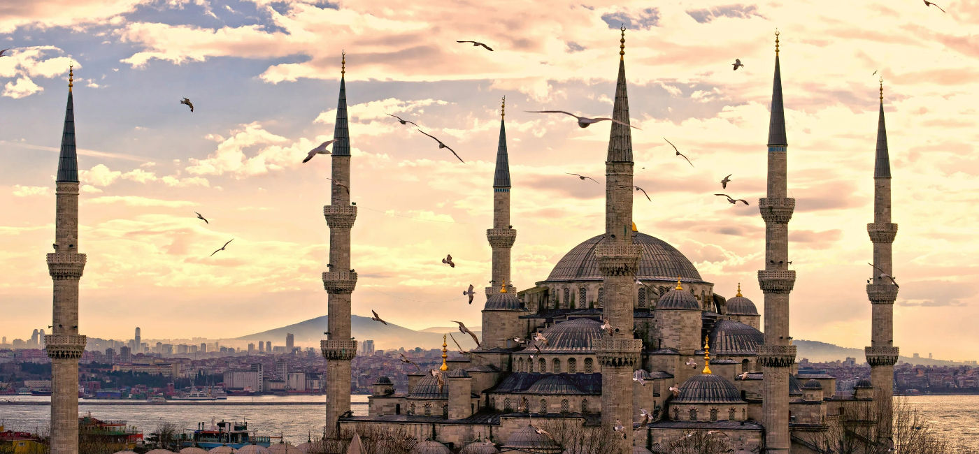 Image: Sunset over The Blue Mosque in Sultanahmet district, Istanbul, Turkey. (Photo Credit: MasterLu / iStock / Getty Images Plus)