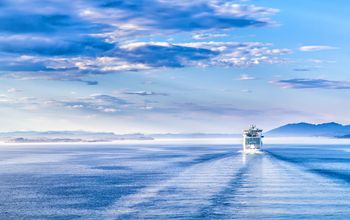 Path on the water from a large cruise ship