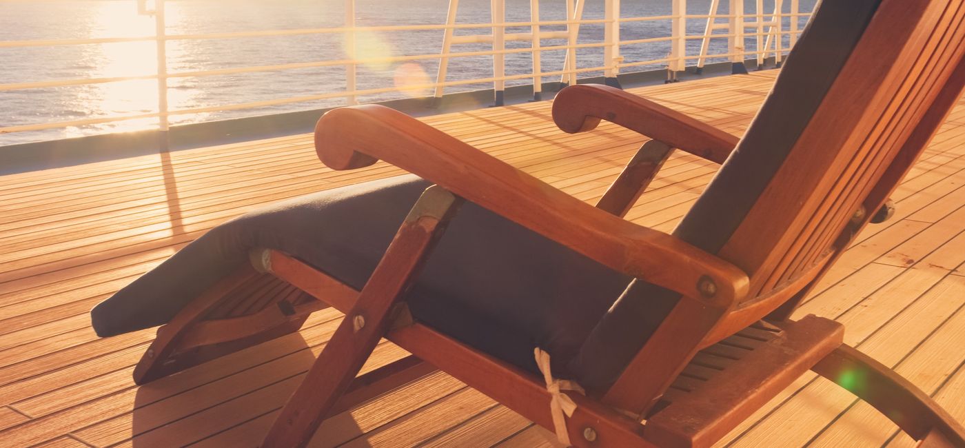 Image: Deck chair on a cruise ship on the promenade deck. (photo via grandriver/Getty Images)