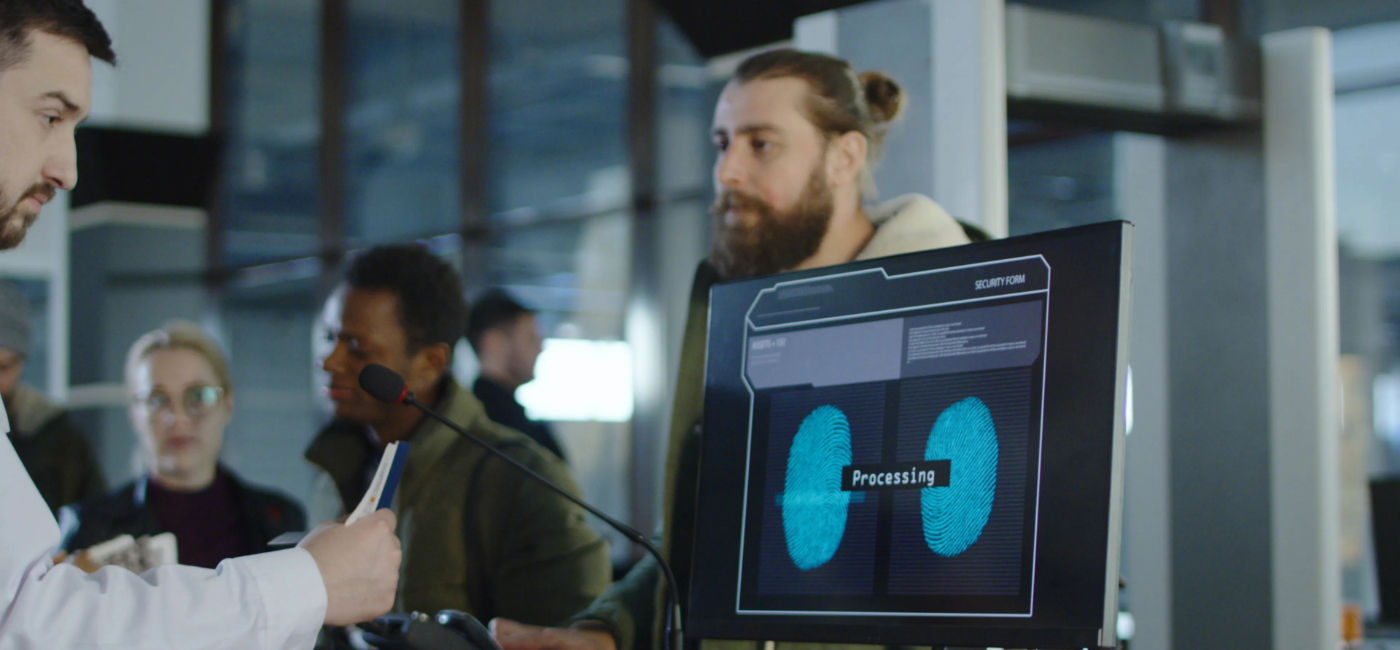 Image: Traveler undergoes a biometric recognition security check. (iStock / Getty Images Plus / EvgeniyShkolenko)