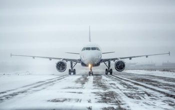 Plane navigating through winter weather