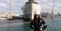 Captain Kate McCue stands in front of Four Seasons I