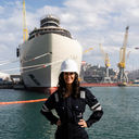 Captain Kate McCue stands in front of Four Seasons I