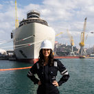 Captain Kate McCue stands in front of Four Seasons I