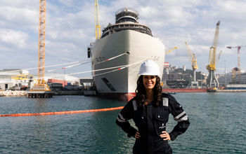 Captain Kate McCue stands in front of Four Seasons I