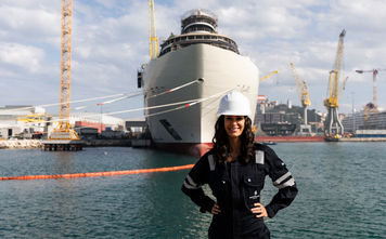 Captain Kate McCue stands in front of Four Seasons I