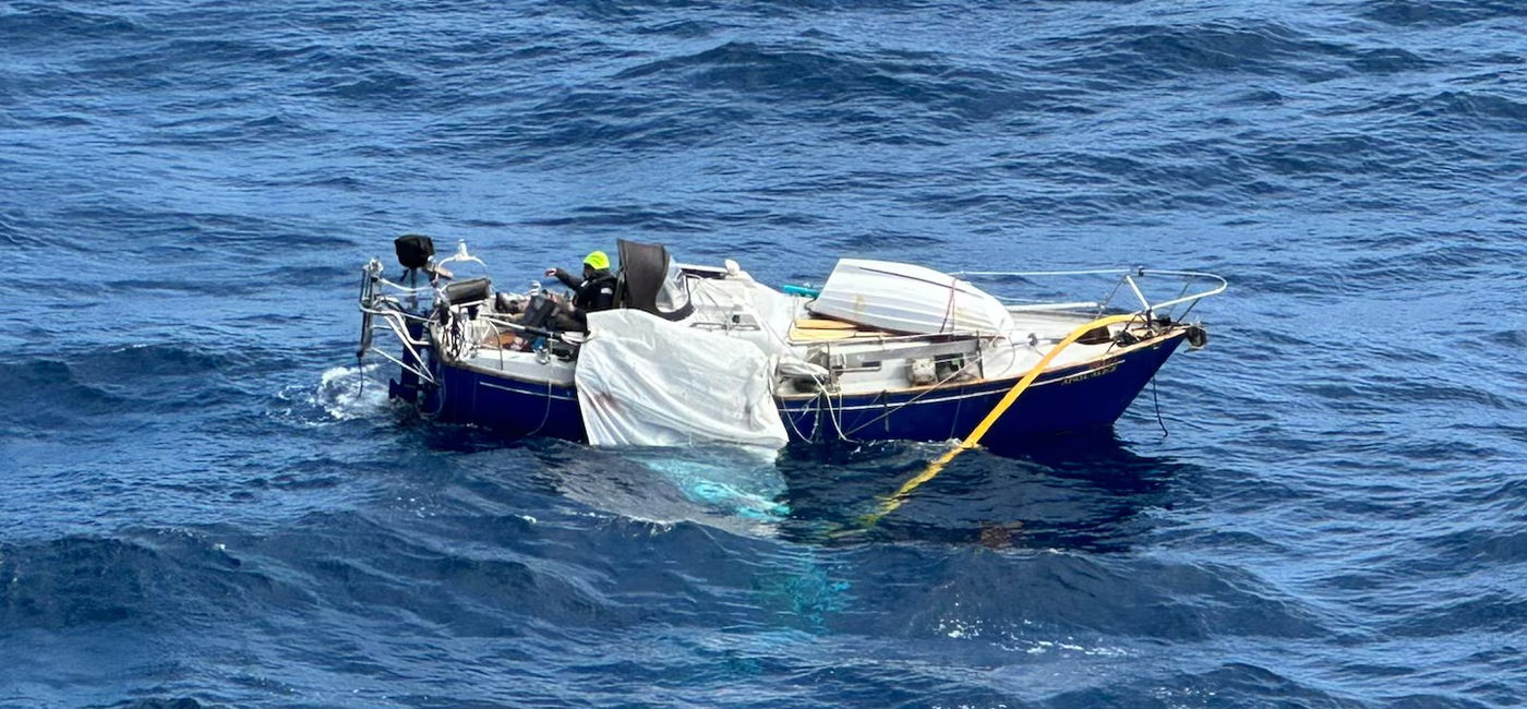 Image: The man's sailboat was disabled by gale-force winds and 30-foot seats (Photo Credit: U.S. Coast Guard)