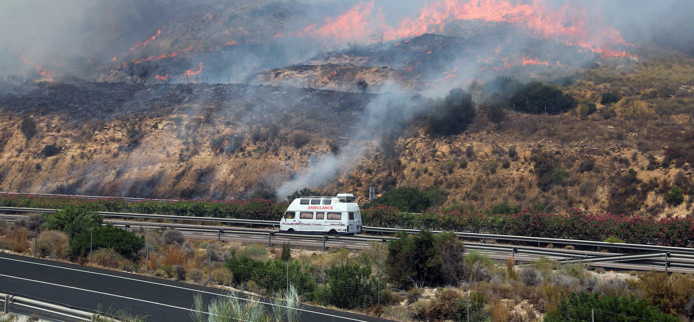Image: A wildfire burns in Spain. (Photo Credit: Adobe/Arafat)