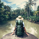 Woman sitting on the edge of a river
