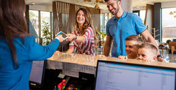 Family checking into hotel