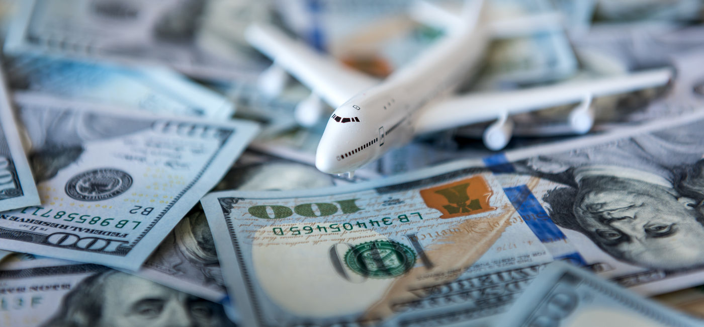 Image: Money makes the aviation industry move. (Photo Credit: Ivan Kmit / Adobe Stock)