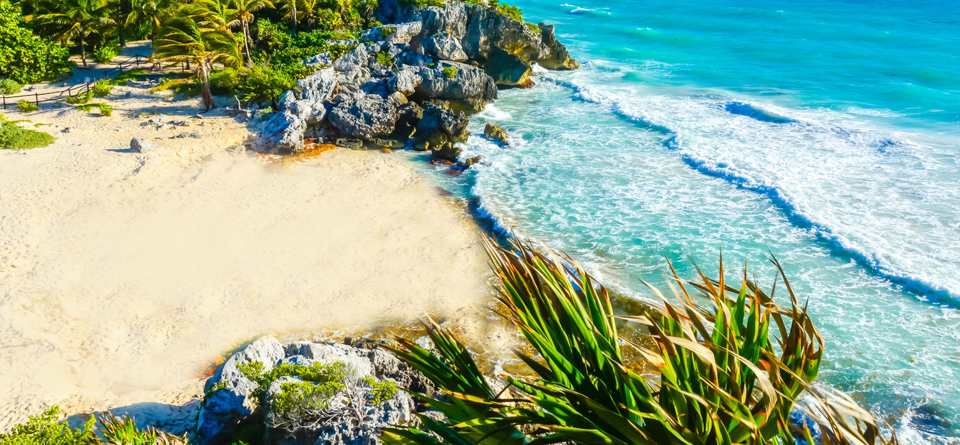 Image: Mayan ruins of Tulum, Mexico. (Photo Credit: Simon Dannhauer / Adobe Stock)