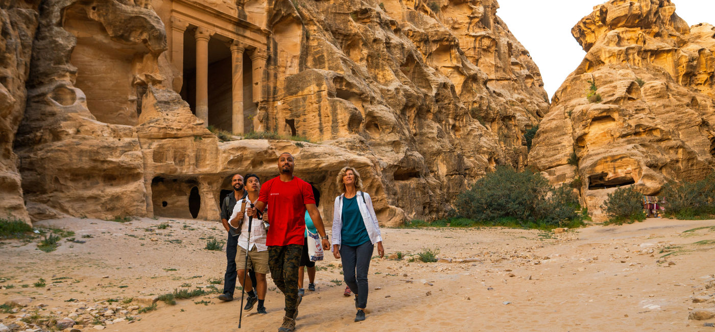 Image: An Intrepid Travel group walking to Petra in Jordan. (Photo Credit: Intrepid Travel)