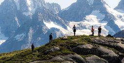 Travelers hiking with mountains in the background