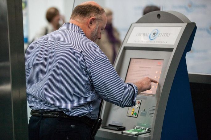 Man using Global Entry kiosk Global Entry kiosk, Global Entry, Trusted Traveler, U.S. Customs and Border Protection