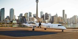 A Porter Airlines Bombardier Q400 aircraft on the tarmac at Billy Bishop Toronto City Airport.
