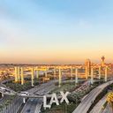 Overview of LAX airport with control tower and aircraft taken from hotel room