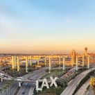 Overview of LAX airport with control tower and aircraft taken from hotel room