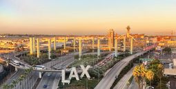 Overview of LAX airport with control tower and aircraft taken from hotel room