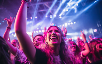 Fans cheering at a music concert.