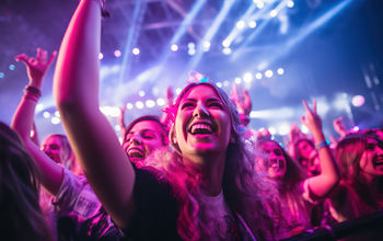 Fans cheering at a music concert.