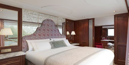 A rendering of a Grand Suite bedroom aboard S.S. Clara