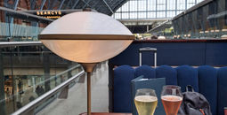 Two glasses of sparkling wine at St. Pancras International railway station in London