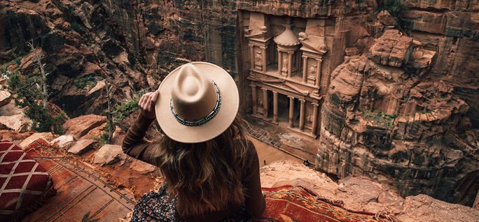 Women looking down at the Wonder of the World in Petra, Jordan