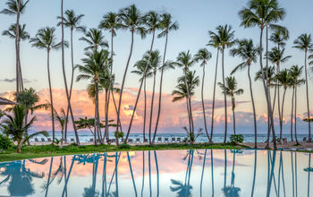 Caribbean Sea views over the main pool at Club Med Mich&#233;s Playa Esmeralda, Dominican Republic.