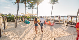 A couple enjoys the beach at the Wyndham Alltra Playa del Carmen