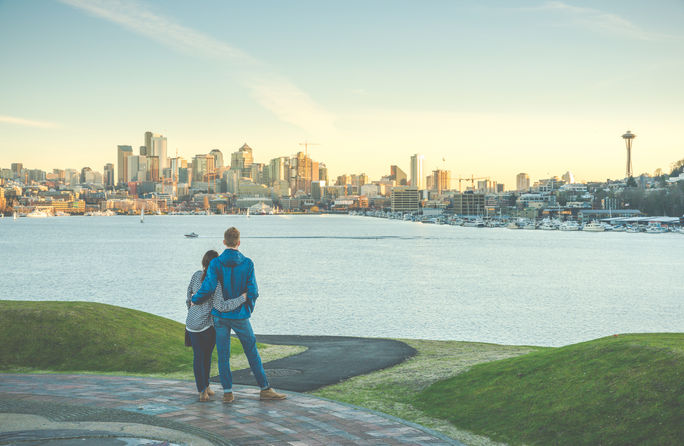 A couple taking in the view of Seattle, Washington A couple taking in the view of Seattle, Washington