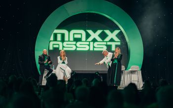 From left, Brian Shultz, CIO; Michelle Fee, founder and CEO; Scott Koepf, chief strategy officer; and Theresa Scalzitti, COO of Cruise Planners, introduce Maxx Assist at CP World 2026