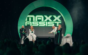 From left, Brian Shultz, CIO; Michelle Fee, founder and CEO; Scott Koepf, chief strategy officer; and Theresa Scalzitti, COO of Cruise Planners, introduce Maxx Assist at CP World 2026