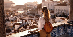 Female tourist gazing at an old town