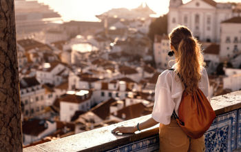 Female tourist gazing at an old town