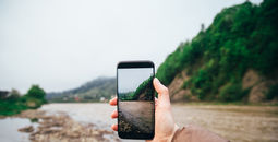 Traveler taking a picture for social media