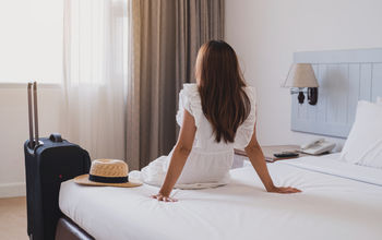 Traveler in hotel room