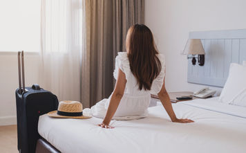 Traveler in hotel room