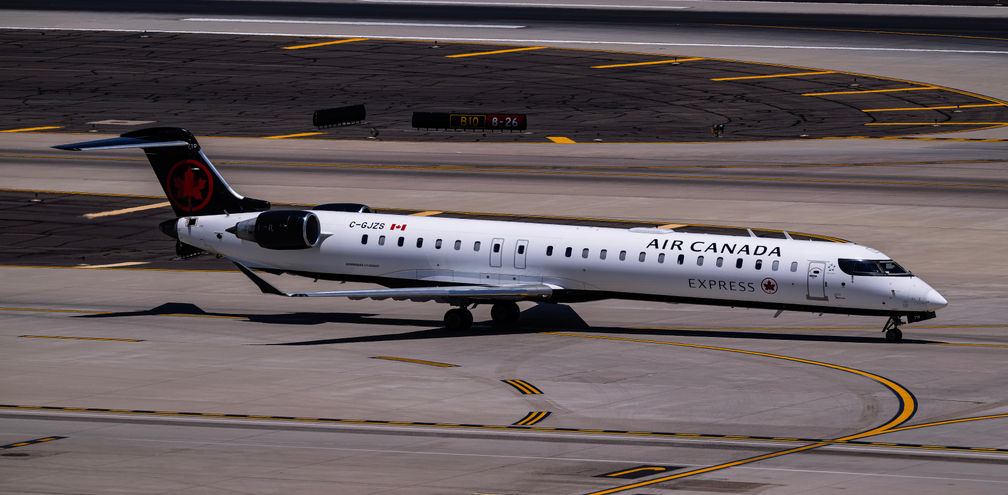 Air Canada Jazz Bombardier CRJ900 C-GJZS landing on runway 26 at Phoenix Sky Harbor Intl. Airport.