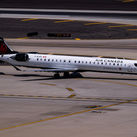 Air Canada Jazz Bombardier CRJ900 C-GJZS landing on runway 26 at Phoenix Sky Harbor Intl. Airport.