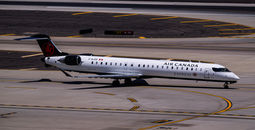 Air Canada Jazz Bombardier CRJ900 C-GJZS landing on runway 26 at Phoenix Sky Harbor Intl. Airport.